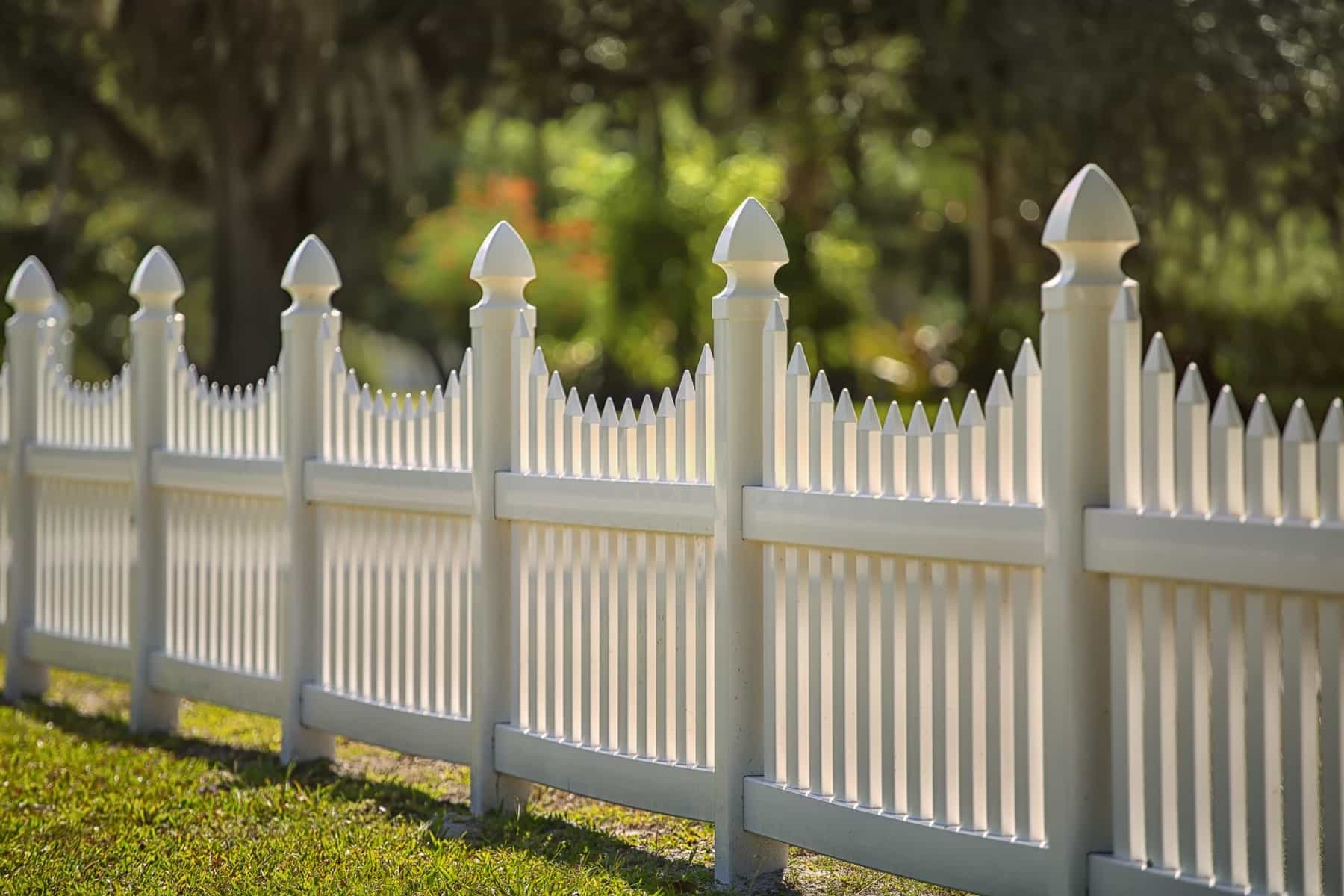 Vinyl fencing on a sloping residential lot